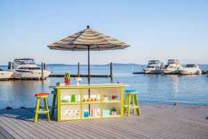 Lime Green on White 3ft x 8ft SummerSide Bar with 6 Bar Stools on a boat dock