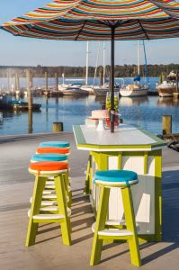 Side view of the Lime Green on White 3ft x 4ft SummerSide Bar with 6 Bar Stools on a boat dock