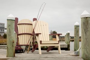 Two folding Poly Adirondack Chairs on a dock