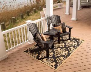 Two Black Poly Adirondacks on a porch