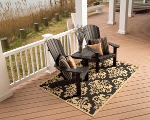 Two Black Poly Adirondacks on a porch