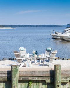 Four Poly SeaAira Adirondack chairs around a conversation table.
