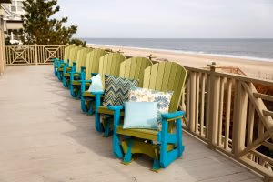 Row of Poly Adirondack Gliders