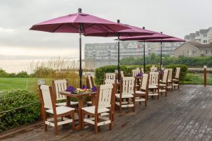 Walnut on Ivory poly colored Keystone chairs around Great Bay tables.