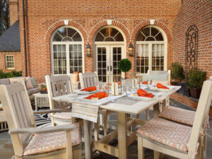 Two Tone Rectangular Poly Dining Table with six chairs with cushions