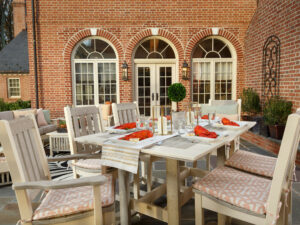 Two Tone Rectangular Poly Dining Table with six chairs with cushions