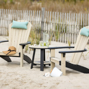 Poly Adirondack Chairs and Poly Table sitting in the sand on the beach