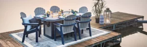 Summerside Fire Table and Great Bay Dining tables set up on dock by lake