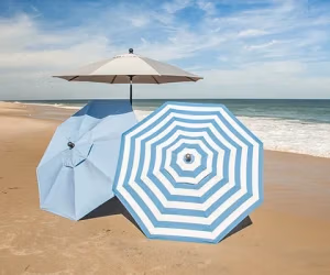 3 umbrellas set up on beach