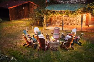 Poly Adirondack chairs around a fire place