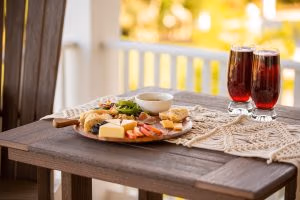 A food tray and drinks on a poly table.