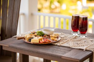 A food tray and drinks on a poly table.