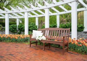 72" Avonlea Garden Bench on a brick patio