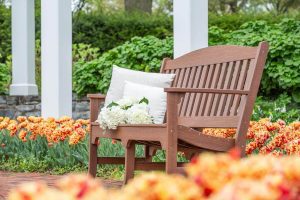 One Avonlea Garden Bench on a brick patio