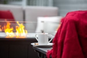 Close up of coffee or tea cup on poly Mission Deep Seating Furniture