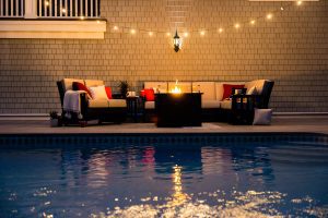 Mission Deep Seating poly furniture in an evening outdoor setting.