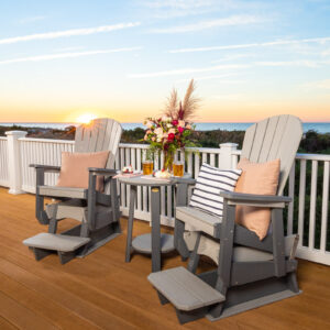 Poly Adirondack chairs and table set on a patio overlooking the water.