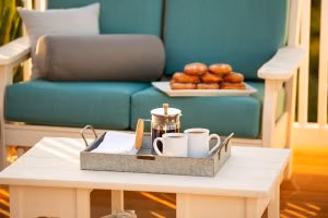 Close up of poly side table with Van Buren Poly Furniture in the background.