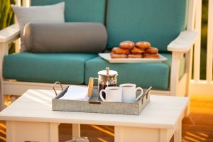 Close up of poly side table with Van Buren Poly Furniture in the background.