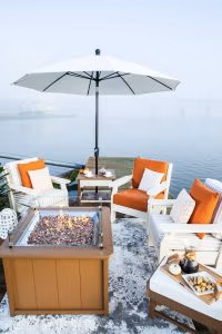 White outdoor umbrella with poly furniture chair set