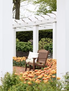 Avonlea Garden Bench on a brick patio