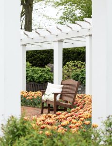 Avonlea Garden Bench on a brick patio
