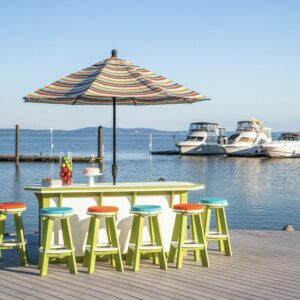 Striped outdoor umbrella with poly furniture bar and bar stools