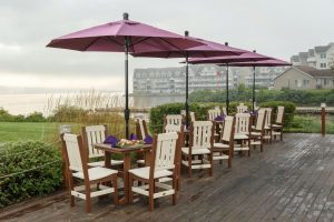 Burgundy outdoor umbrellas with poly furniture dining sets