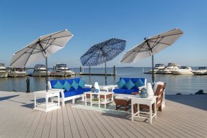 White and blue outdoor umbrellas with poly outdoor furniture