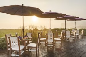 Burgundy outdoor umbrellas with poly furniture dining sets