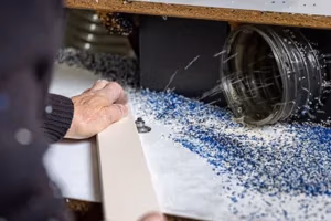 finch craftsman routing a profiled edge on a piece of furniture