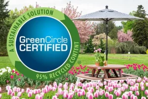 picnic table and umbrella in a garden of tulips with Green Circle Certified badge