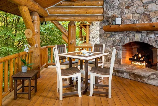 Keystone Dining Counter Height chair and table set on porch of log cabin