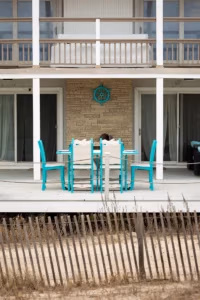 Wave Counter Table and chair set shown in Turquoise and Seashell poly lumber