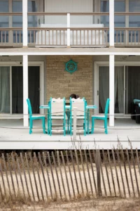 Wave Counter Table and chair set shown in Turquoise and Seashell poly lumber