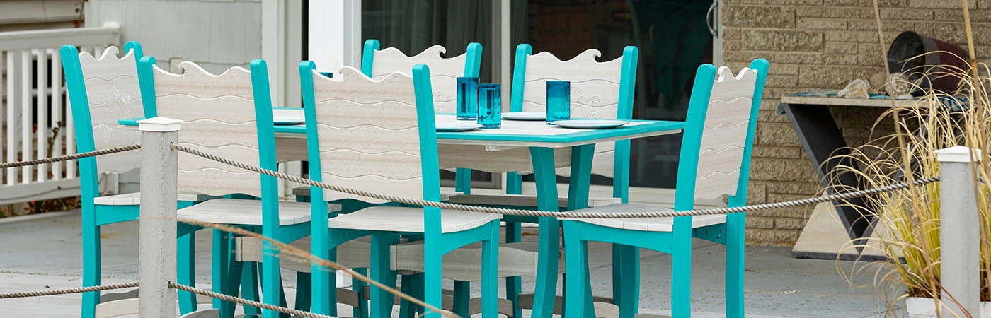 wave dining table and 6 chair set on patio at ocean front home