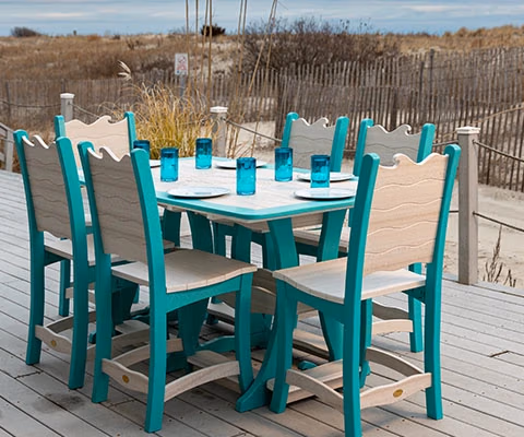 wave dining table and 6 chair set on boardwalk by the beach