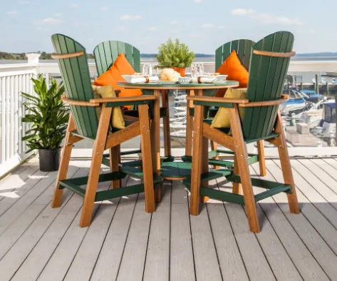 Four bar height chairs sitting together at a table.