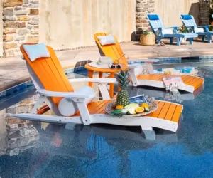 Two orange lounges in a shallow pool
