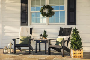 skyward poly patio furniture black porch chairs with green pillows close up