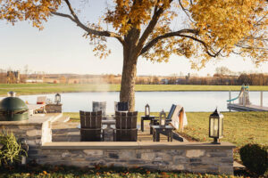 skyward poly patio furniture centered tree and firepit seating area